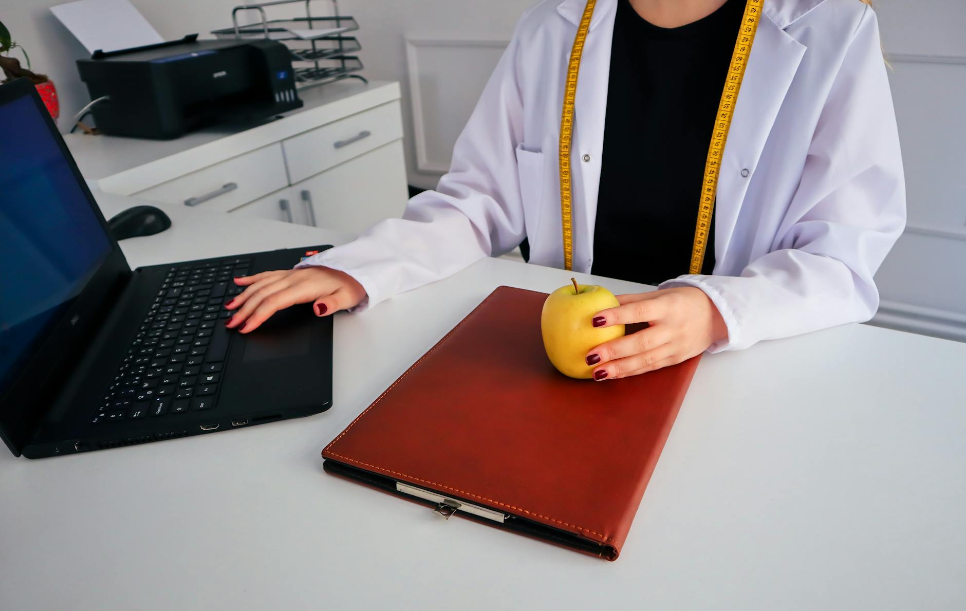 dietician working on laptop